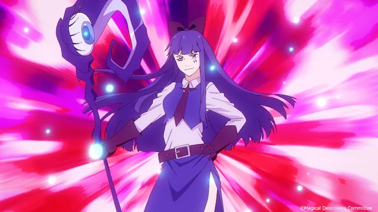 Wielding a witch's crook with a bulbous blue eyeball protruding from the top of it, Blue prepares to wreak havoc in a scene from the upcoming Magical Girl Destroyers TV anime.