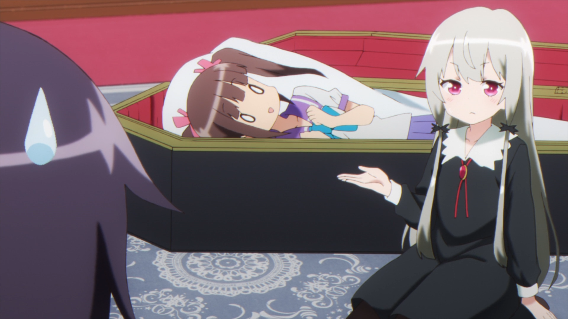 In an effort to trick a vampire hunter, Sophie Twilight shows off the body-pillow she keeps in her coffin in a scene from the 2018 Ms. Vampire who lives in my neighborhood. TV anime.