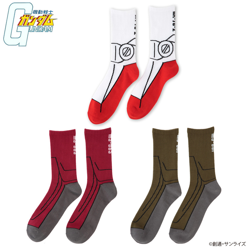 A promotional image of the BanColle! Mobile Suit Gundam MS Impersonator socks line, featuring socks that mimic the feet area of the RX-78-2 Gundam, the MS-06S custom Zaku, and the MS-06F production line Zaku.