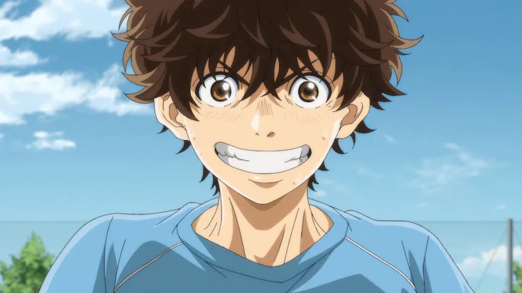 Ashito Aoi grins wildly during a soccer practice in a scene from the Aoashi TV anime.