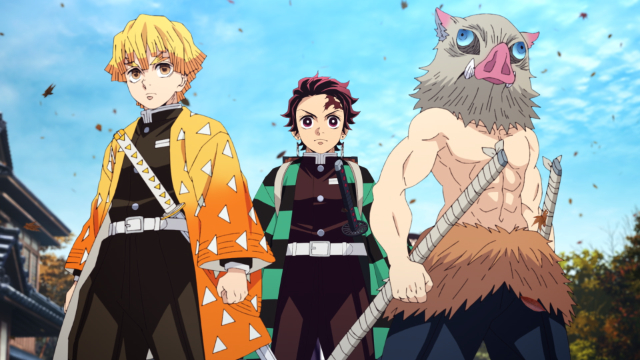 Zenitsu, Tanjiro, and Inosuke pose dramatically beneath the clear blue sky with determined expressions on their faces in a scene from the Demon Slayer: Kimetsu no Yaiba TV anime.