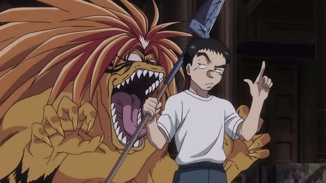 Tora, un yokai monstruoso que se parece a un tigre, intenta comerse a Ushio mientras Ushio blande la lanza de la bestia hacia él en una escena de comedia del anime de televisión Ushio & Tora de 2015-2016.