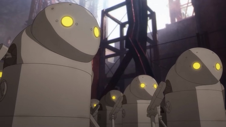 A group of "Stubbies" - boxy, cylindrical Machine Life Forms that look like wind up toys with glowing yellow eyes - congregate at the Abandoned Factory in a scene from the upcoming NieR:Automata Ver1.1a TV anime.
