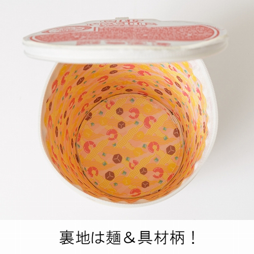 A promotional image featuring a look at the interior design of the Cup Noodle-themed pouches included as a pack-in bonus for Takarajimasha's CUP NOODLE 50TH ANNIVERSARY BOOK.