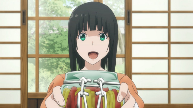 Makoto offers her friends and family some homemade pickles in a scene from the Flying Witch TV anime.