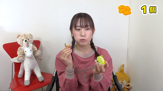 Voice actress Minori Suzuki attempts to eat 105 Chicken McNuggets from McDonald's in a scene from her "Minoringo" Youtube show.