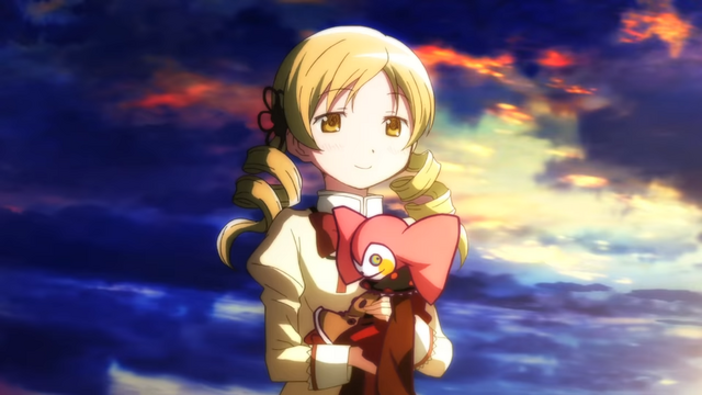 Mami in Puella Magi Madoka Magica, holding Bebe in her arms.