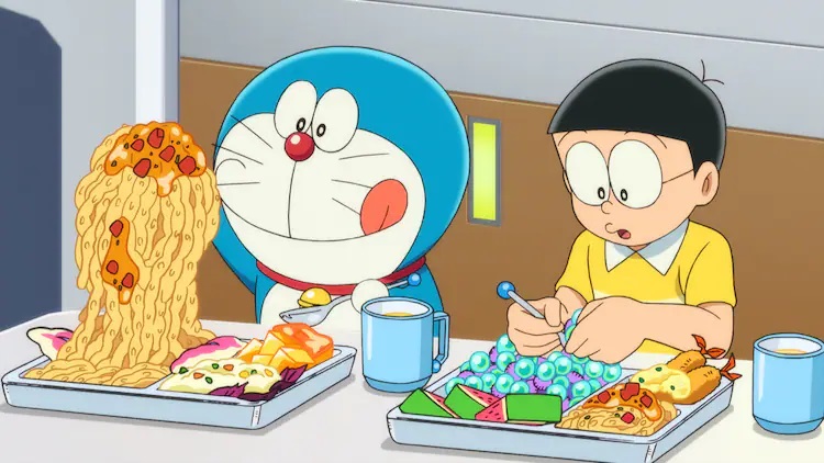 Doraemon and Nobita enjoy a strange meal together in a scene from the Doraemon: Nobita's Little Star Wars 2021 theatrical anime film.