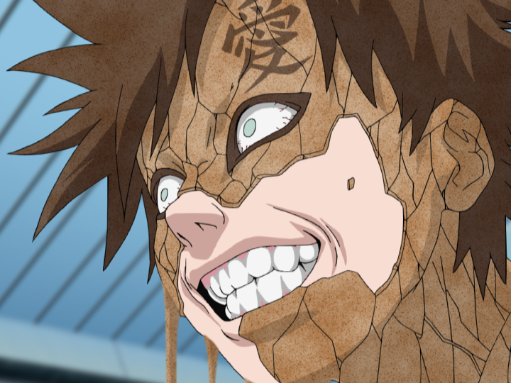 Gaara grins maniacally as his sand armor begins to fracture in his climactic battle with Rock Lee during the Chunin Exams in a scene from the Naruto TV anime.