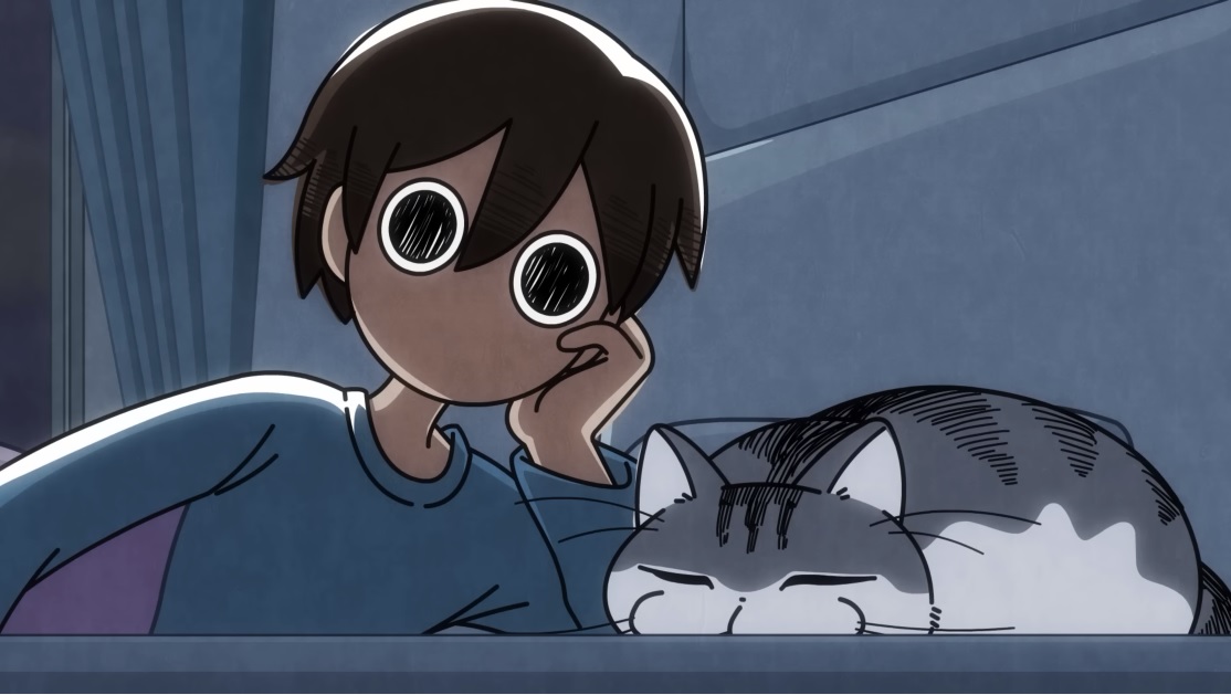 En su dormitorio a oscuras, Fuuta mira fijamente al gato de su hermana, Kyuruga, que duerme plano como un panqueque junto a él en su cama.