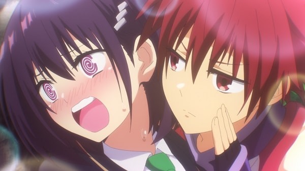 Heroine Suzu Kanade is flustered by protagonist Matsuri Kazamaki whispering innuendos in her ear in a scene from the Ayakashi Triangle TV anime.