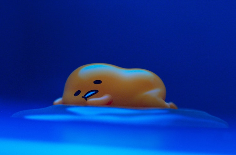 Gudetama lazes about in a scene from the upcoming Gudetama: An Eggcellent Adventure Netflix series.
