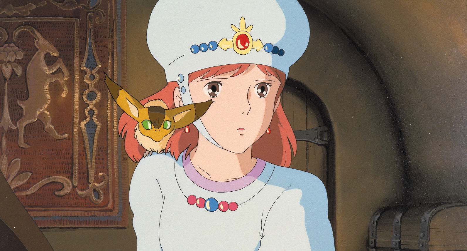 Princess Nausicaä and her fox-squirrel companion Teto share a look of concern in a scene from the 1984 Nausicaä of the Valley of the Wind theatrical film.