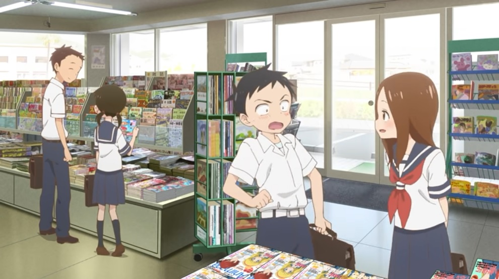 Nishikata is surprised by Takagi's magazine suggestion while the two of them browse the shelves of a convenience store in a scene from the OP animation of the third season of the KARAKAI JOZU NO TAKAGI-SAN TV anime.