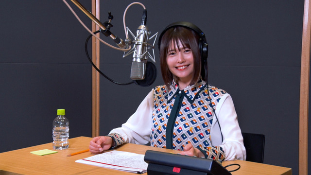 Voice actor Ayana Taketatsu sits in front of a microphone in preparation for her work on a TV commercial for the Jumputi Heroes puzzle RPG smart phone game published by LINE Corporation.