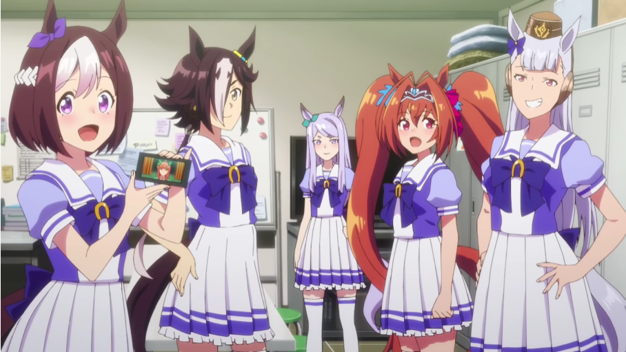 Team Spica - composed of Special Week, Silence Suzuka (via Facetime), Vodka, Mejiro McQueen, Daiwa Scarlet, and Gold Ship - gather together in their club room to greet Tokai Teio in a scene from the Umamusume: Pretty Derby Season 2 TV anime.