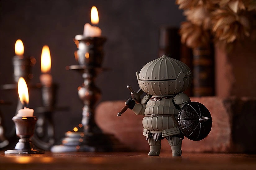 A promotional image of the Good Smile Company Nendoroid Siegmeyer toy featuring the valiant Knight of Catarina posed in his neutral stance while wearing the Catarina armor and wielding the zweihander sword and the pierce shield.