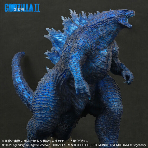 A promotional image for the "Gigantic Series Godzilla (2019) Blue Clear Ver." figure from Premium Bandai featuring a half-profile view of the toy from the side.