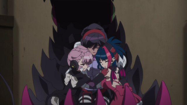 Vanessa huddling Millaarc and Elza to protect them.