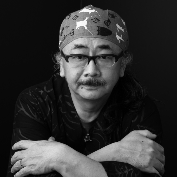 A promotional photograph of composer Nobuo Uematsu, most famous for his musical arrangements for the Final Fantasy video game series.