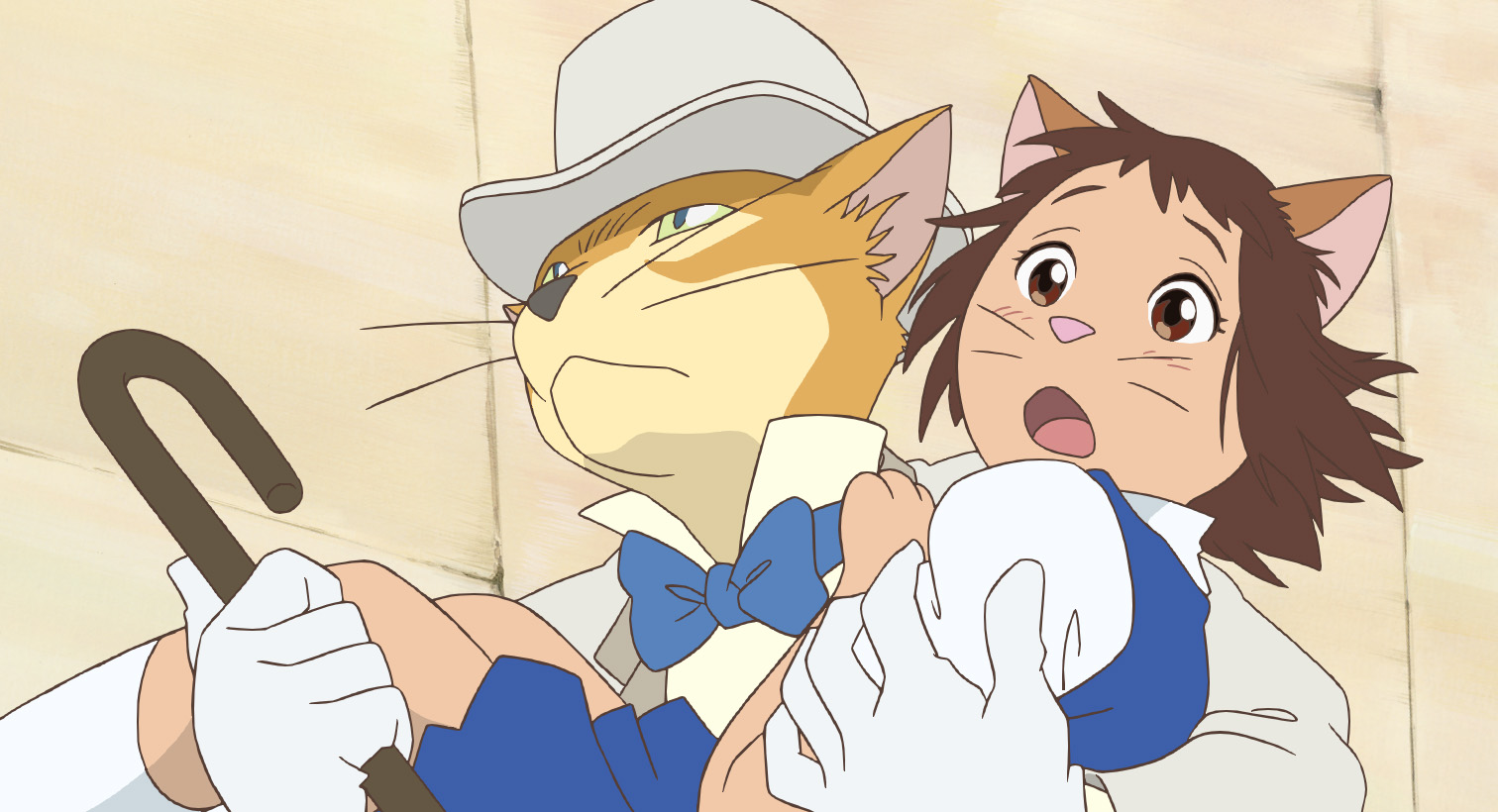 The Baron, a cat who walks on two legs and wears a top hat and a fine set of gentlemanly human clothing, carries a half-transformed Haru like a princess in a scene from The Cat Returns theatrical anime film.