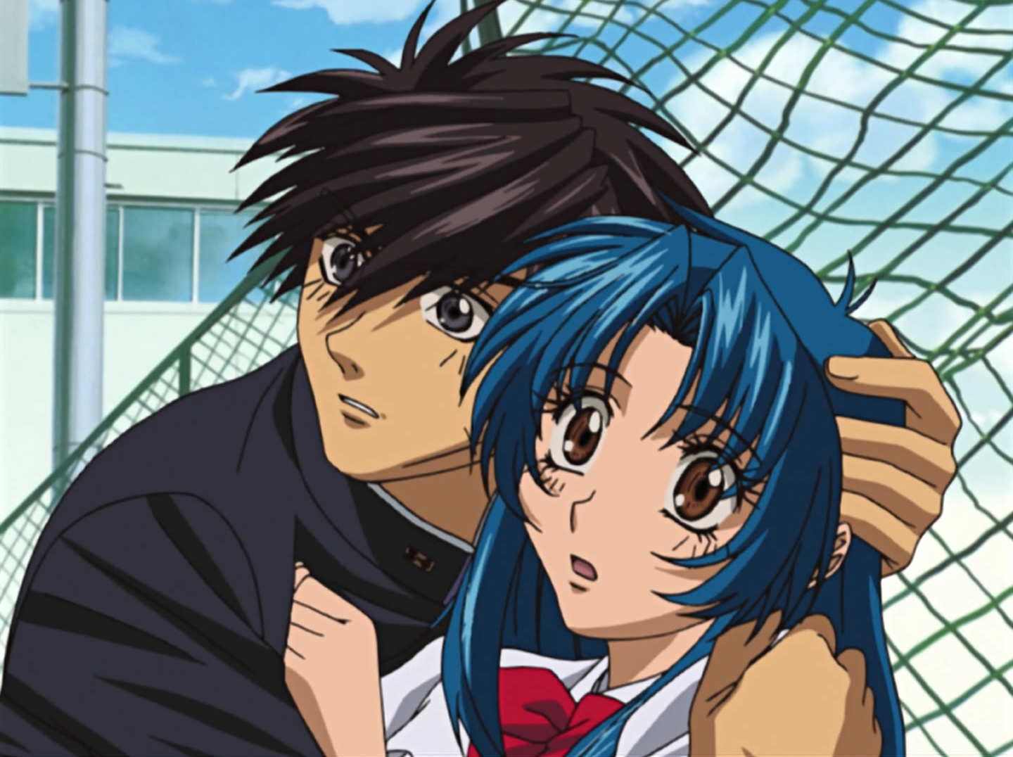 Sousuke attempts to protect Kaname from a perceived threat in a scene from the Full Metal Panic! TV anime.