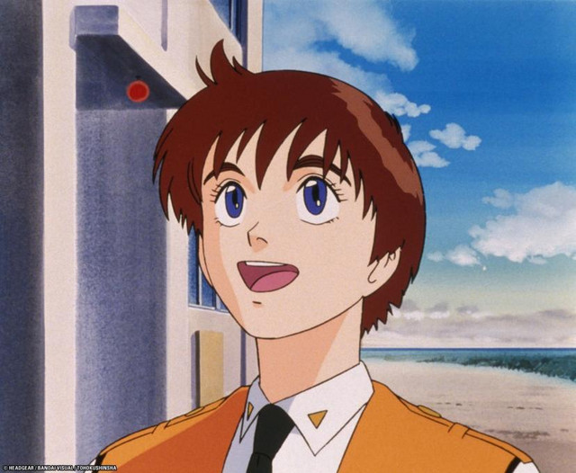 Noa Izumi looks up in admiration at her off-screen Ingram in a scene from the Patlabor the Mobile Police New Files OAVs.