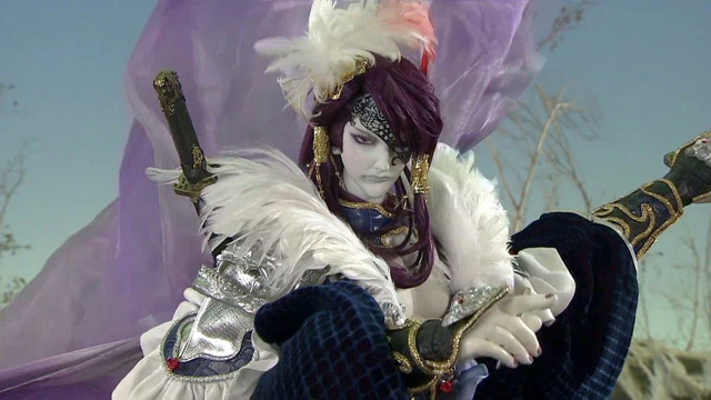 The Screaming Phoenix Killer points dramatically in a scene from the first season of Thunderbolt Fantasy.