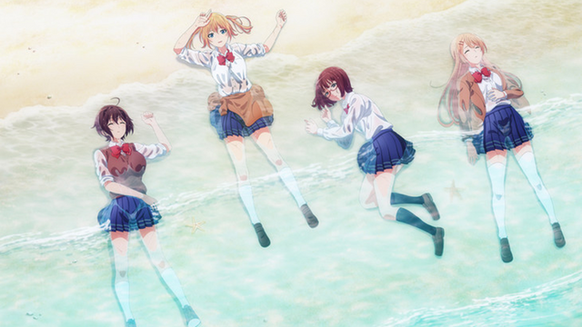 The high school girls of Are You Lost? lay shipwrecked on a sandy beach.