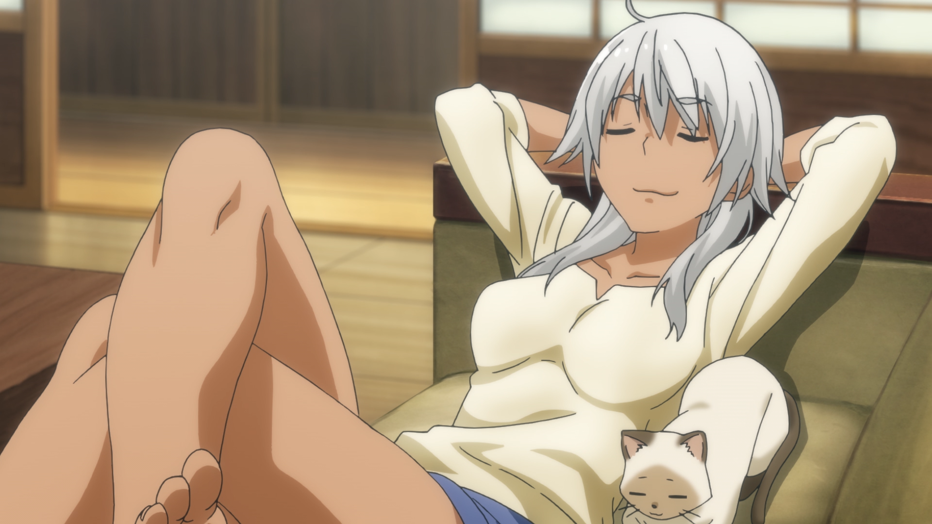 Akane Kowata and her familiar, Kenny, loaf on the couch in a scene from the Flying Witch TV anime.