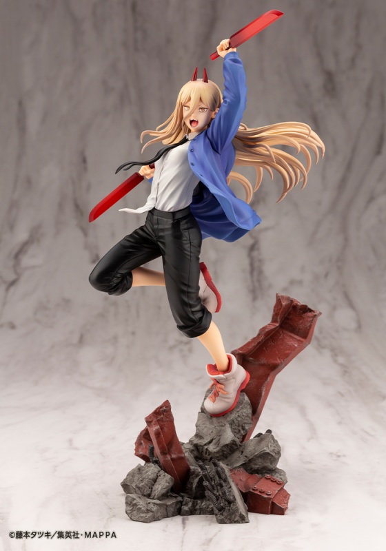 A promotional image for the ARTFX J Power 1:8 scale figure from Kotobukiya featuring a wide view of the figure. Power is posed dramatically on a stand made of (faux) steel and concrete rubble. She wears sneakers and a sloppily composed outfit of blazer, dress shirt, tie, and slacks while wielding two blood daggers and yelling at the top of her lungs. Her long hair is lashing about as if blown by the wind or caught in mid-spin.