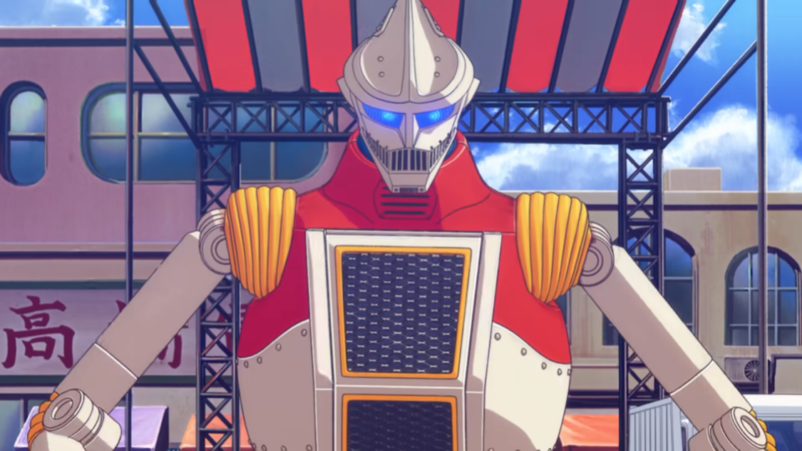 The Jet Jaguar humanoid robot is displayed in front of a band stand style stage in a scene from the upcoming Godzilla Singular Point anime.