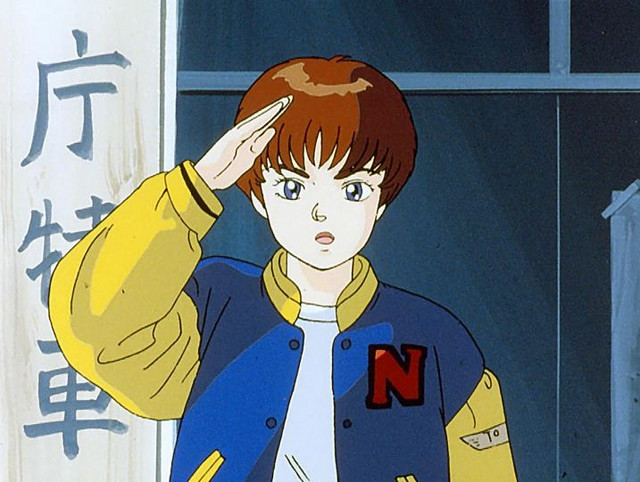 Noa Izumi salutes her new comrades in a scene from the Patlabor The Mobile Police OAVs.