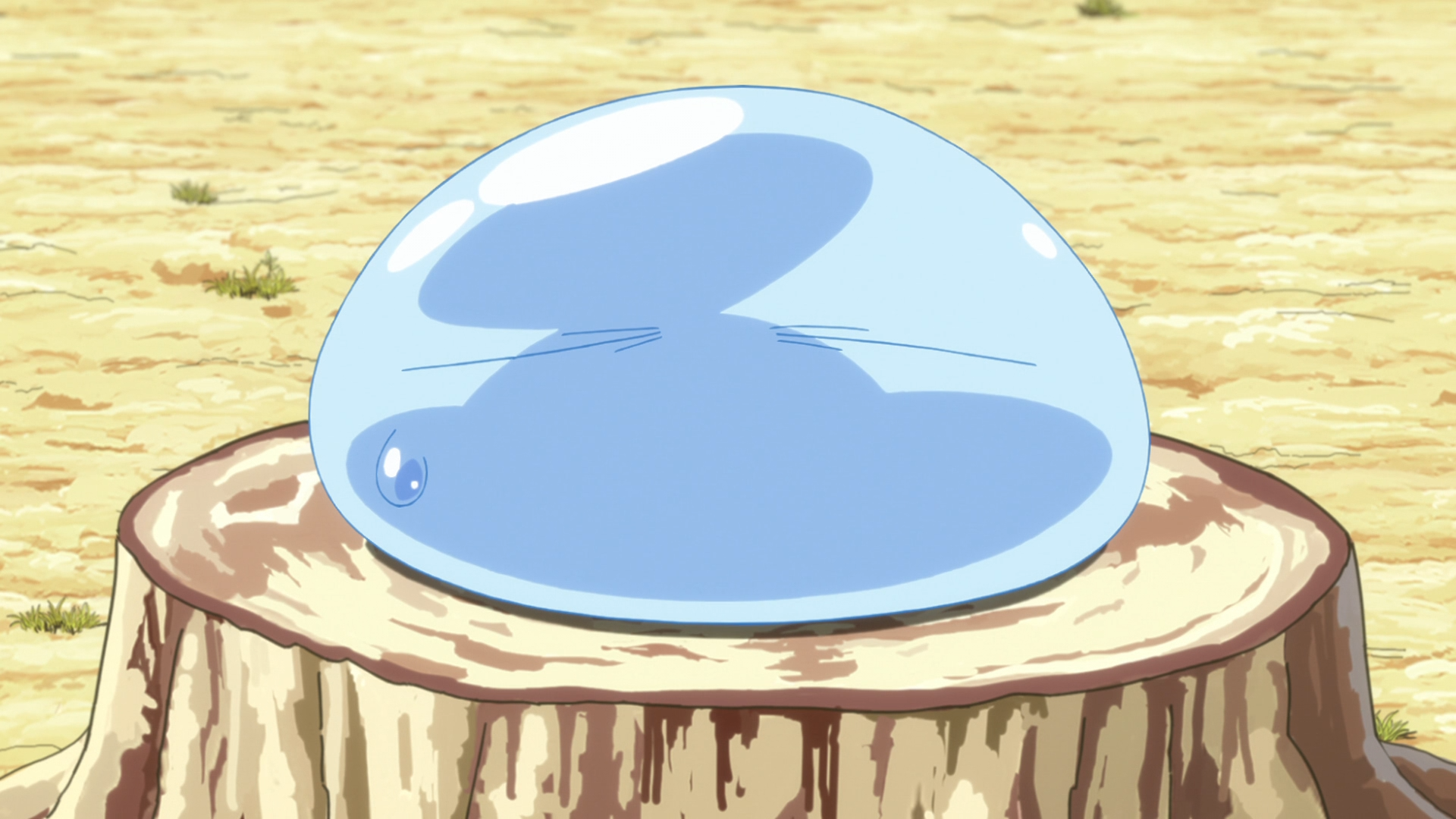 Sitting on a tree stump in slime form, Rimiru prepares to listen to the Goblins' pleas for help in a scene from the That Time I Got Reincarnated as a Slime TV anime.